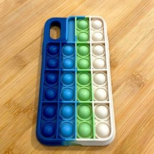iPhone X pop it case in navy, light blue, light green, and off white